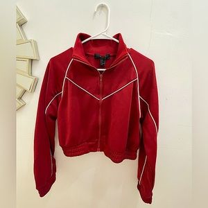 Short red jacket with white lines